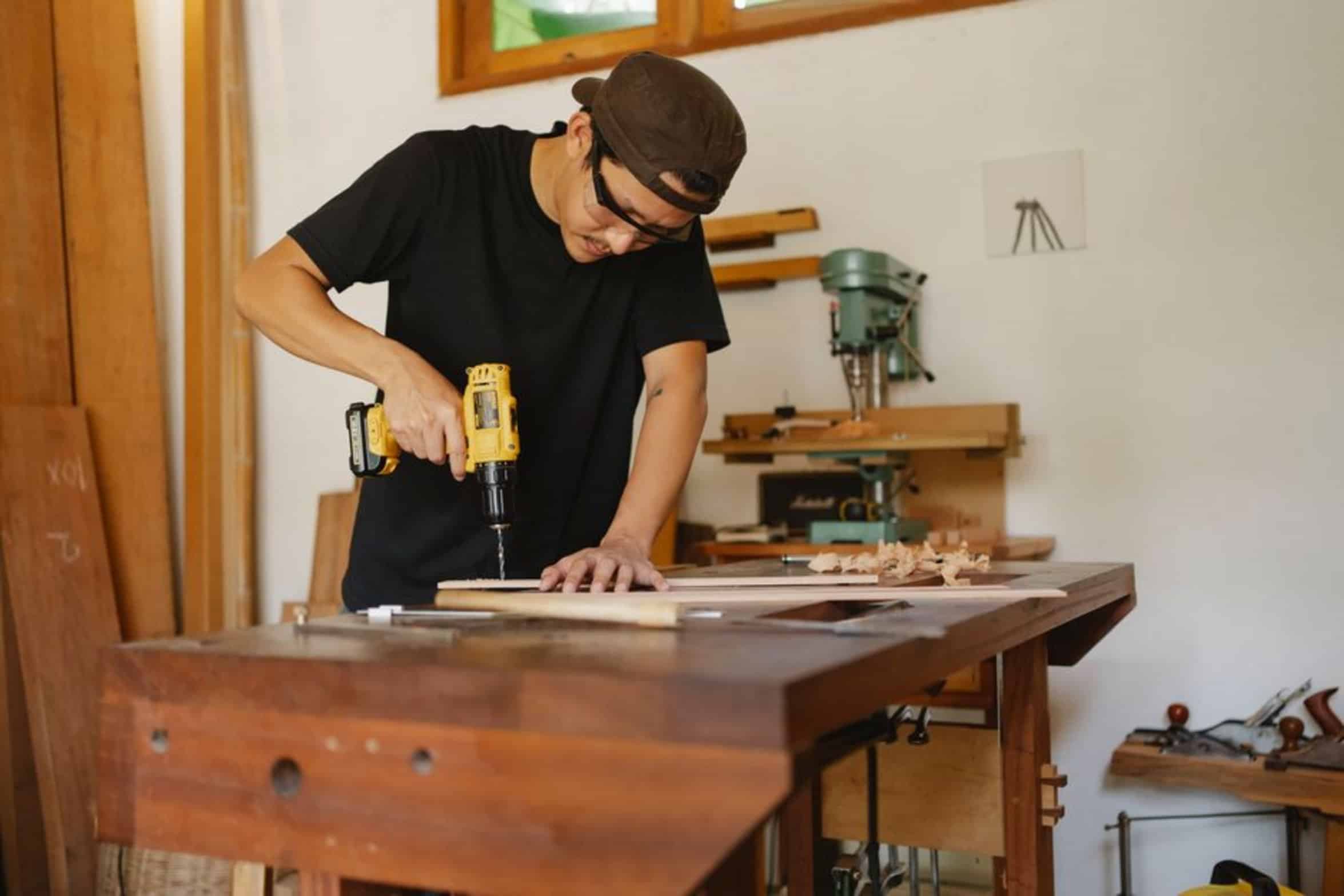 carpenter using finish nailer carpenter using finish nailer