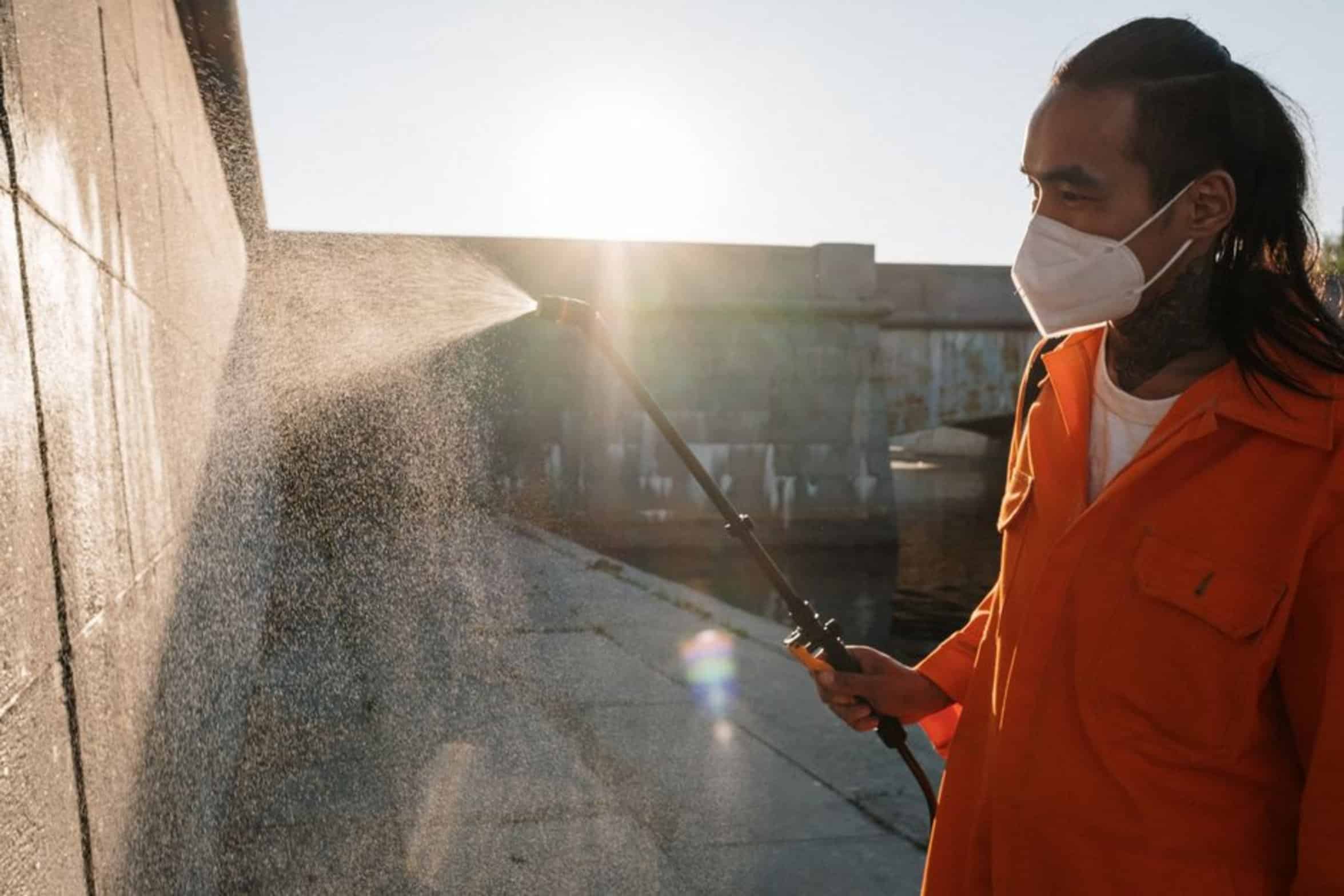 man using spray gun man using spray gun